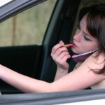 Distracted driver putting on makeup in Lexington, KY